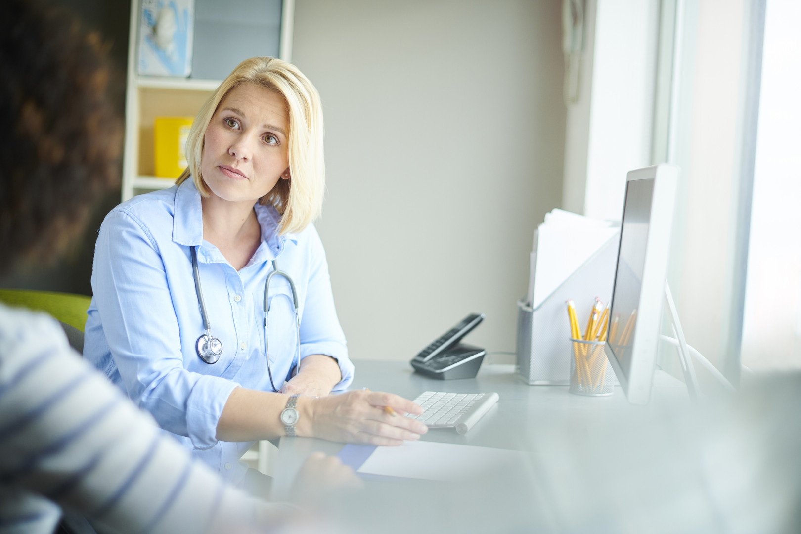 Female doctor with patient.