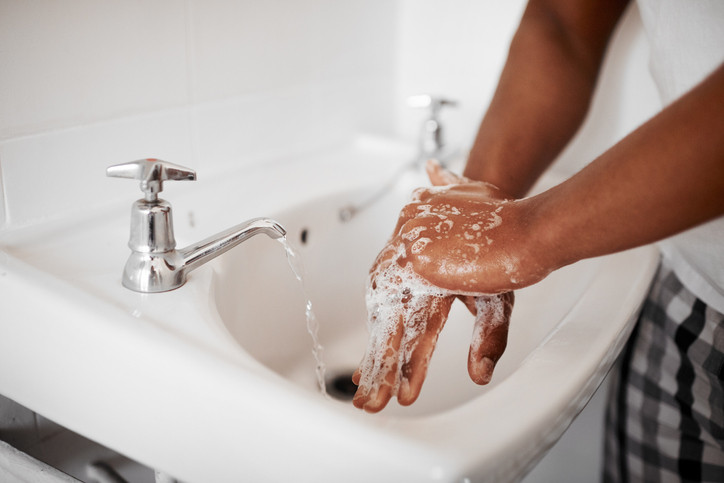 Man washing hands.