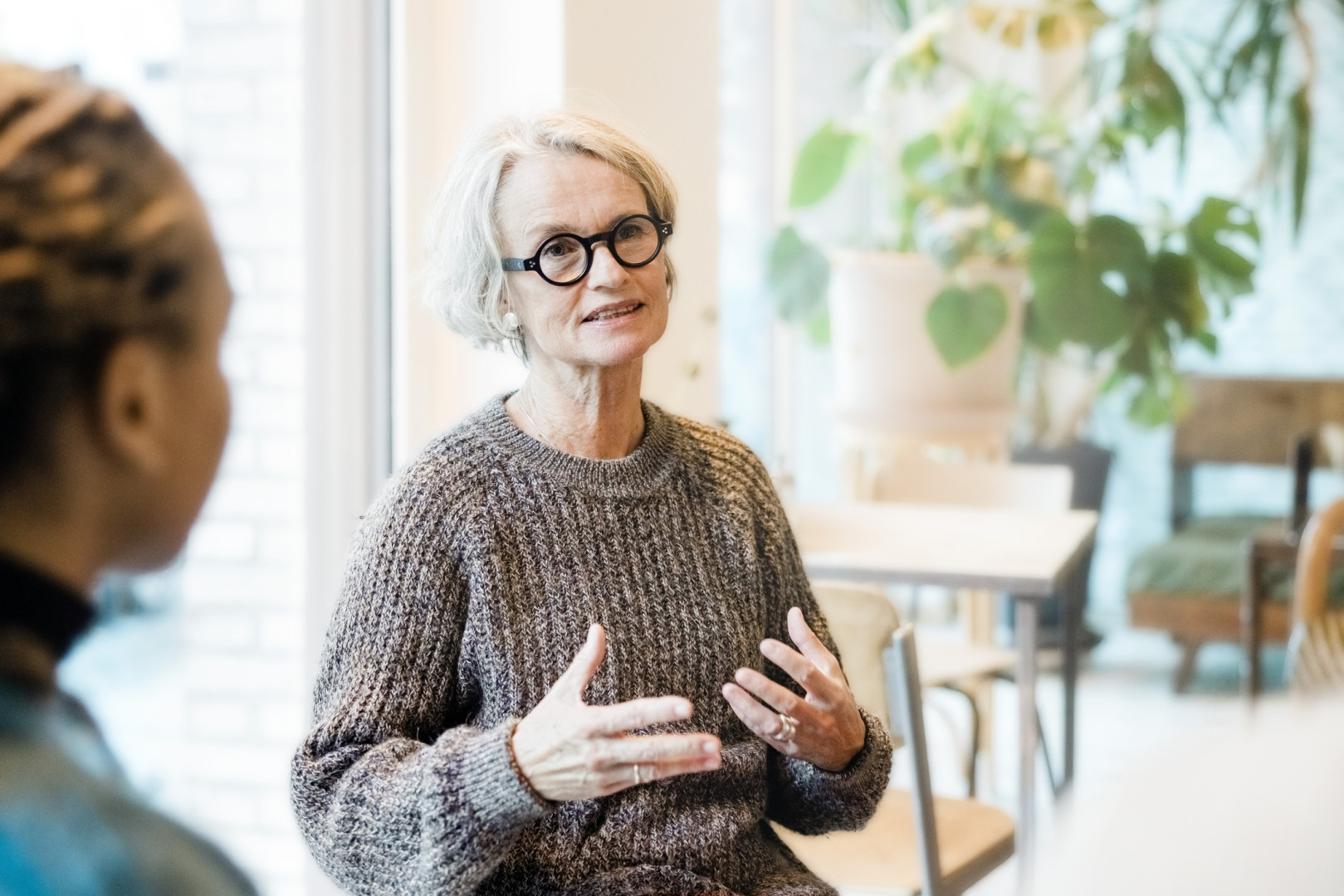 Woman talking to group.