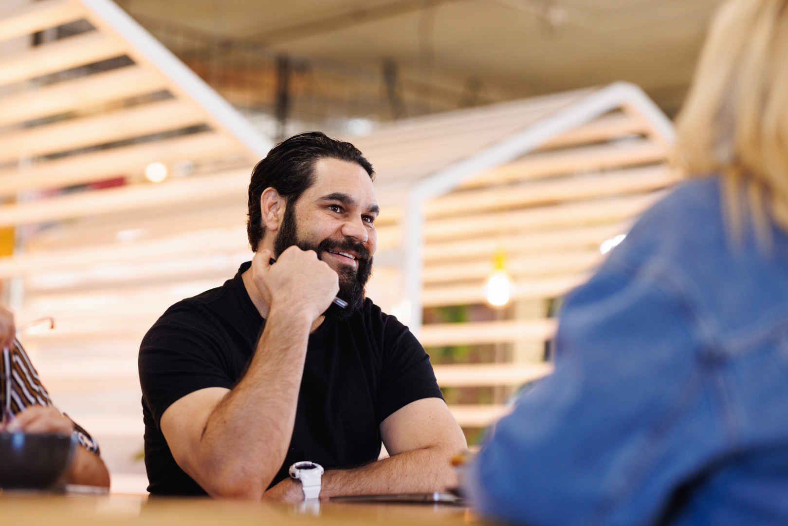 Aboriginal man talking with coworkers